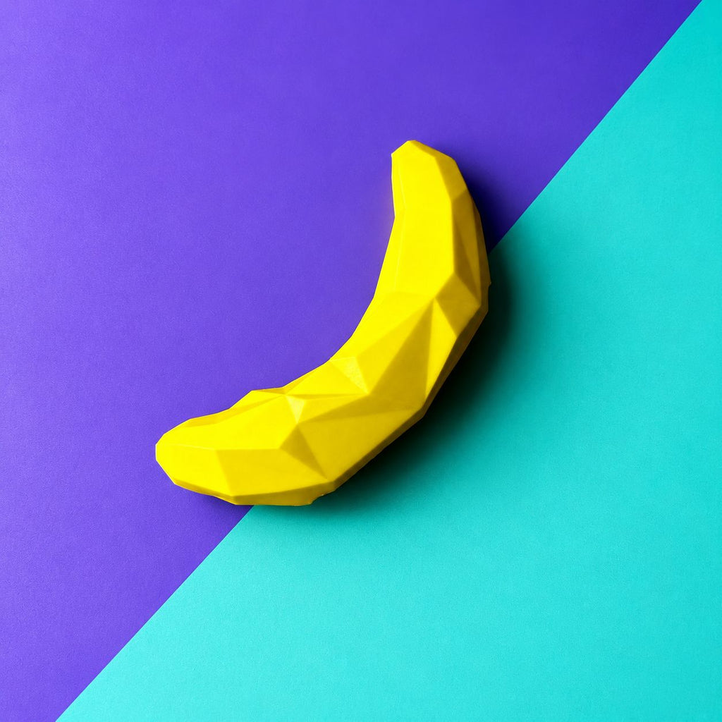 Juguete banana dispensador de premios color amarillo