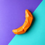 Juguete banana dispensador de premios color naranja