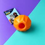 Juguete pera naranja con abertura para galletas y snacks